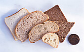 Slices of bread of different kinds on a light background