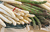 White and green asparagus spears on a cloth