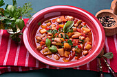 Vegan vegetable stew with white pinto beans and chickpeas