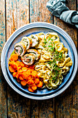 Turkey herb roulade with glazed carrots and tagliatelle