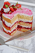 White summer cake with red berries