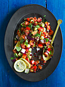 Shirazi salad (Chopped cucumber, tomato and pomegranate)