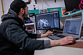 Man working on the design of a 3D printed robot