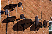 Satellite dishes on a wall