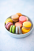 Bowl of colorful macarons (France)