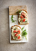 Vegan tofu spread with cherry tomatoes and dill