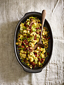Roasted cauliflower salad with leafy greens and nuts