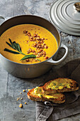 Carrot, parsnip and sage soup with crispy dukkha chickpeas