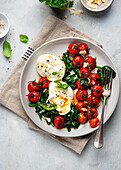Poached egg with spinach and oven-roasted tomatoes