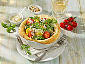 Rocket and tomato salad in a bread dough basket
