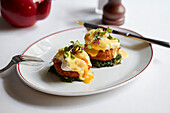 Fishcakes with poached eggs and hollandaise sauce