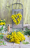 Heart and bouquet of tansy (Tanacetum vulgare) with rubbing lattice