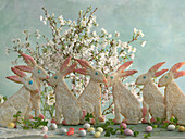 Easter bunnies made of shortcrust pastry with sugar icing, sugar eggs and Japanese ornamental cherry
