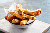 Pieces of chicken wrapped in filo pastry