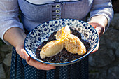 Serve airy curd cheese dumplings on elder compote