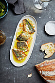 Grilled seabass in olive oil and onions