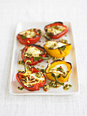 Peppers with halloumi, chilli and pine nuts