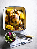 Golden roast chicken with corn, sage, and garlic