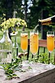 Champagne cocktails being poured
