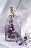 A bottle of lavender oil on a fine cloth