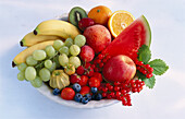A bowl of fruit, on a light background
