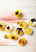 Mini tartelets decorated with edible flower petals