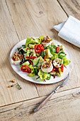 Salad with grilled goat cheese and walnuts