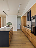 Contemporary kitchen with wooden cabinet fronts and kitchen island
