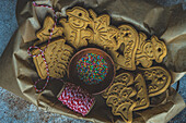 Tasty cookies for Christmas tree decoration on concrete table