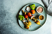 Organic vegetable BBQ on plate board on concrete table