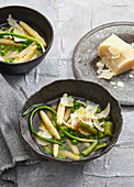 Broth soup with Parmesan gnocchi and asparagus