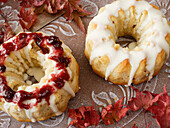 Mini bundt cakes with icing and cranberries