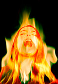 Woman in flames screaming, conceptual image