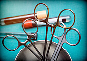Surgical scissors in an operating room, conceptual image