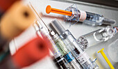 Phials and syringe in laboratory