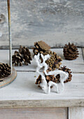 Deer figurine made of cotton with it pinecones