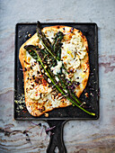 Tarte flambée with black cabbage, cauliflower, mozzarella and cheese