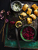 Lamb and kale rolls with two kinds of pickled cabbage