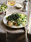 Savoy cabbage roulades with chicken filling and broccoli-celery mash