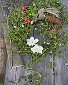 Mistletoe wreath with rose hips and spruce cones