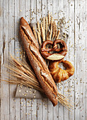 Baguette, pretzel and croissant with ears of grain