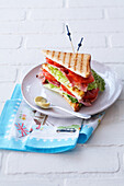 Club sandwich with bacon, lettuce and tomato