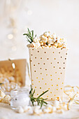 Salty popcorn with butter and rosemary