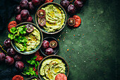 Hummus with coriander and red grapes