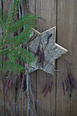Wooden star with birch twigs and spruce