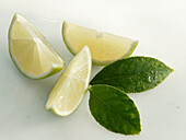 Three lime slices with leaves