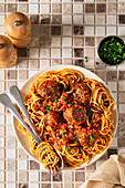 Meatballs in tomato sauce with spaghetti on a plate