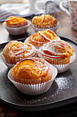 Orange muffins with icing sugar