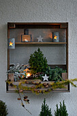 Wooden shelf on the terrace with pre-Christmas decoration