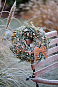 Wreath made of conifer greenery and larch twigs, covered with hoarfrost